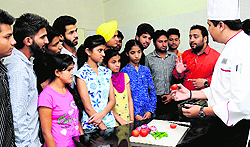 Children with disabilities being briefed by experts about the food production course at Aasha Kiran, in Sector 46, Chandigarh, on Tuesday