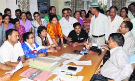 Residents protest at the Jal Sansthan office against inadequate water supply in Dehradun on Tuesday.