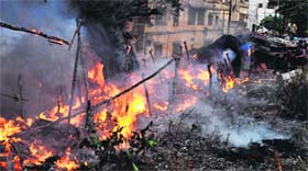 A fire rages in a slum colony near Bhimgoda in Haridwar on Monday.
