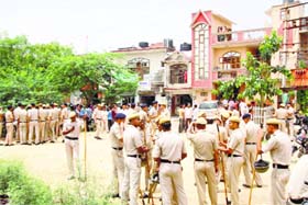 Police personnel in the Surat Nagar area of Gurgaon on Tuesday