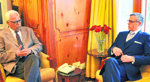 Governor NN Vohra interacts with Chief Minister Omar Abdullah at Raj Bhawan in Srinagar on Tuesday.
