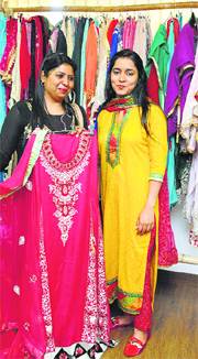Priyanka Singh (L) shows her creations