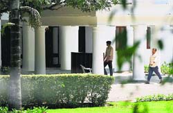 Labourers at work at 3 Motilal Nehru Marg bungalow, the new residence of PM Manmohan Singh, in New Delhi on Tuesday. PTI