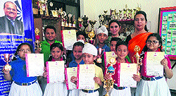 Ryan International School students with trophies and certificates won at various state-level competitions in Amritsar