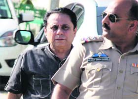 Dr Lalit Vermani, who is facing a rape charge, being taken to a court in Sector 43, Chandigarh, on Wednesday