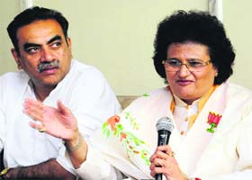 Arti Mehra, in charge of the city BJP unit, along with city unit president Sanjay Tandon, at a press conference in Sector 33, Chandigarh, on Wednesday