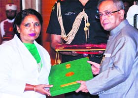President Pranab Mukherjee confers the National Florence Nightingale Award-2014 on Kailash Rashid Mashi, staff nurse, Government Multi-Speciality Hospital, Sector 16, Chandigarh, at the Rashtrapati Bhawan in New Delhi