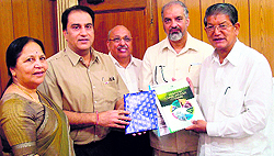 Officials from CII meeting Chief Minister Harish Rawat in Dehradun on Wednesday