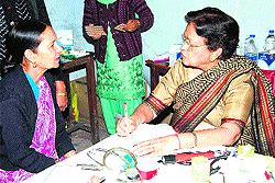 A medical expert examines a patient during the free medical camp organised in Mussoorie on Tuesday