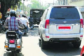 Vehicles with black films on their windowpanes in Jammu