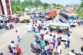 Protesters block a highway in Jammu on Wednesday