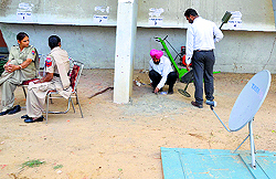 A bomb disposal team checks a venue where EVMs have been kept on the PAU campus in Ludhiana