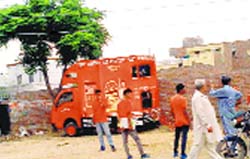 A vehicle carrying billboards of a beer brand in Faridkot. Tribune photo
