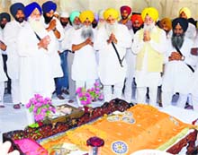 Revenue Minister Bikram Singh Majithia performs ardaas at Akal Takht in Amritsar on Wednesday. Tribune photo
