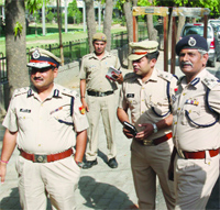Delhi Police officers outside the counting centre in Gole Market, New Delhi, on Thursday. 