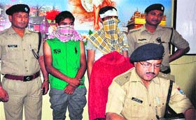 Haridwar SP (City) Surjeet Singh Pawar presents two chain snatchers at Jwalapur police station in Haridwar on Thursday