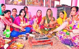 PRAYING FOR THE VICTORY: BJP women activists perform a yajna in Haridwar on Thursday