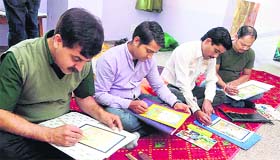 Participants give a final touch to miniature paintings during the workshop Laghu Chitravali Sangam at the Visual Art Department, HP University, in Shimla on Thursday.