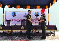GOC-in-C of the Northern Command Lt Gen Sanjiv Chachra hands over the Colonel of the Rajput Regiment Baton to Lt Gen Aniruddha Chakravarty at Fatehgarh on Thursday.