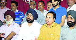Industrialists talk to the police authorities in Jalandhar on Thursday