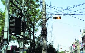 Streetlights left switched on during daytime at Gole Market in Model Town in Ludhiana on Thursday