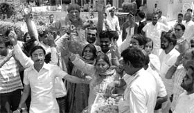 Banto Kataria, wife of Rattan Lal Kataria, and BJP workers celebrate his victory at the party office in Sector 2, Panchkula, on Friday.