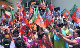 BJP activists celebrate the victory of the party at its office in Sector 33, Chandigarh, on Friday.