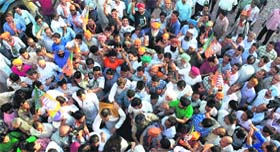 BJP supporters cheer for Kirron Kher outside the party office in Chandigarh on Friday.