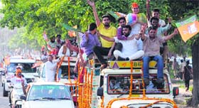 Kirron Khers supporters take out a victory rally in Chandigarh on Friday.