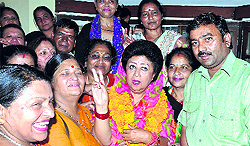 BJP candidate Mala Raj Laxmi Shah with party workers after winning the election in Dehradun on Friday