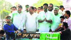 Dushyant Chautala celebrates victory with Abhay Singh Chautala and others in Hisar on Friday. Photo: Banshi Lal Basniwal