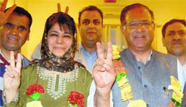PDP president Mehbooba Mufti and party leader Tariq Hameed Karra after winning from Anantnag and Srinagar constituencies, in Srinagar on Friday.