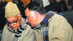 NC president Farooq Abdullah with party leader Mehboob Beg in Srinagar on Friday.