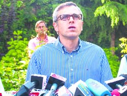 Omar Abdullah addresses mediapersons at his residence in Srinagar on Friday.