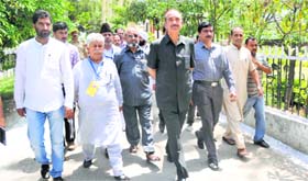 Union Health Minister Ghulam Nabi Azad walks towards a counting centre in Kathua on Friday.