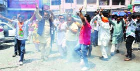 BJP supporters celebrate the party victory in Jammu on Friday.