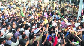 PDP supporters greet partys winning candidate Tariq Hameed Karra in Srinagar on Friday.