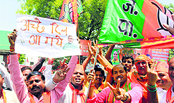 BJP workers celebrate the partys victory in Lok Sabha elections in Lucknow on Friday