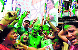 Supporters of the Trinamool Congress celebrate the party election results near the house of party supremo and West Bengal Chief Minister Mamata Banerjee in Kolkata on Friday