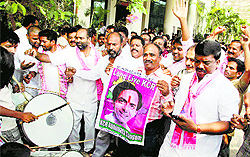 TRS workers celebrate their win at the party office in Hyderabad on Friday