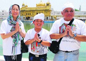 PIETY: Thailand's Ambassador Chalit Manityakul and his family pay obeisance at the Golden Temple in Amritsar on Saturday