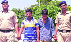Two theft accused in custody of police at the Police Station, Sector 14, Panchkula. Tribune photo