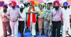 Prem Singh Chandumajra (centre) along with his family members goes to pay obeisance at Gurdwara Amb Sahib in Phase VIII, Mohali, on Saturday. A Tribune photograph