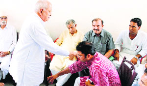 State Congress chief Ashok Tanwar seeks the blessings of a supporter at his residence in Sirsa on Saturday.
