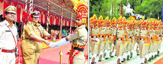 Seema Suraksha Bal Inspector General Renuka Mishra awards a recruit at the passing-out parade of the Basic Training Centre at Shamshi in Kullu on Saturday; and (right) New recruits of the Seema Suraksha Bal during a passing-out parade at the Basic Training Centre at Shamshi in Kullu on Saturday.