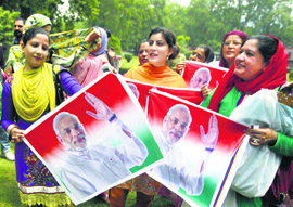 BJP activists celebrate partys win in the Lok Sabha polls in Srinagar on Saturday.