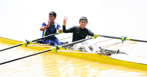 Piyush Sharma and Sukhdev Singh (left) flash the victory sign after winning the double scull event during the state rowing championship at Sukhna Lake in Chandigarh on Sunday