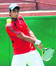 A player in action during the CLTA-AITA tennis tournament at Sector 10, Chandigarh, on Sunday