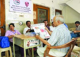 TIME TO READ THE PULSE OF VOTERS AGAIN: Aam Aadmi workers at the party office near Connaught Place in New Delhi on Sunday