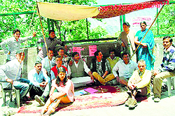 Members of the Bhotia Market Traders Forum hold a dharna in support of their demands in Mussoorie on Sunday